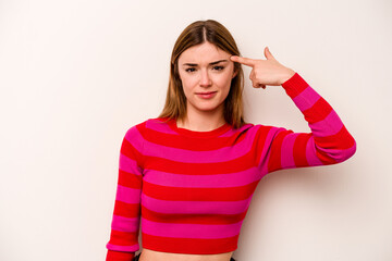 Young caucasian woman isolated on white background showing a disappointment gesture with forefinger.