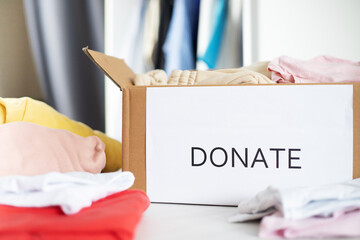 donations and charity, clothes in a box for the homeless, the poor, humanitarian aid