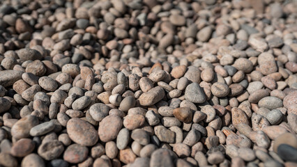 Rocks and stones on the beach in Normandy, France.