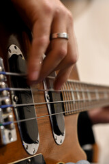 Guy playing the bass on a recording day