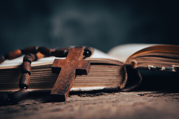 wooden cross on the book