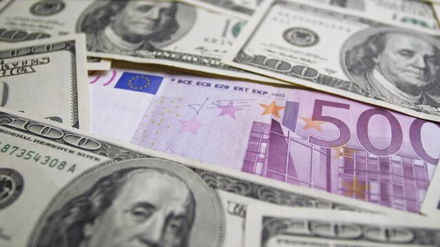 Footage of rotating cash banknotes from different states of the European Union and the United States of America