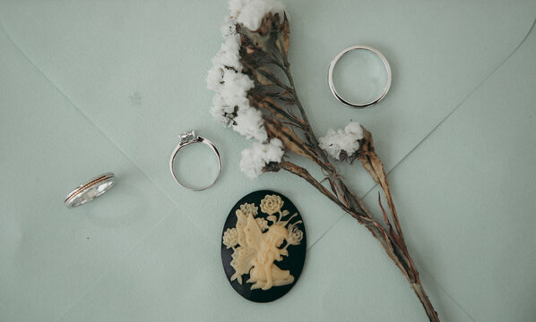Photo of flowers, rings and jewelry