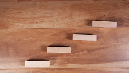 Wooden blocks stacking as step stair