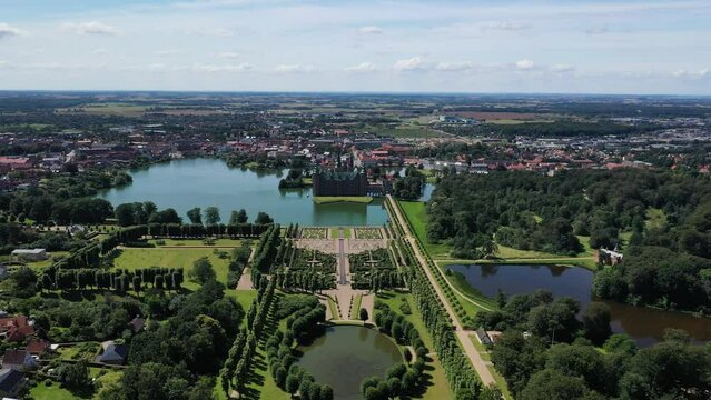Wide-Angle View of Frederiksborg Castle and Its Gardens in Hillerod Denmark - Forward Panning Drone Shot