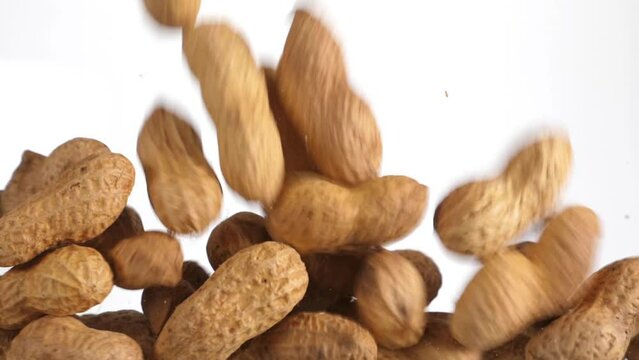 peanuts fall in slow motion and cover the whole screen