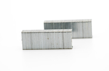 Metal staples for a stapler that was used in office or school isolated on white background.