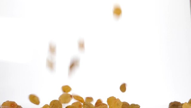 raisins fall in slow motion and cover the whole screen