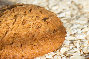 Oatmeal cookies close-up. Dry breakfasts for children. Rolled oat, oat flakes background.