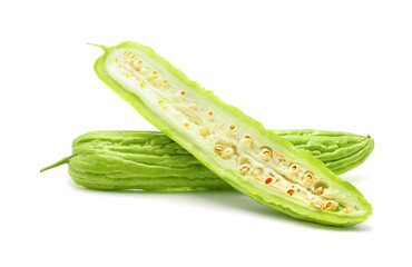 Fresh green bitter cucumbers or chinese bitter gourd sliced isolated on white background.