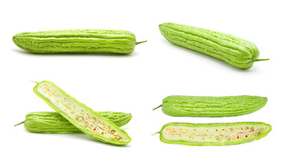 Set of fresh green bitter cucumbers or chinese bitter gourd sliced isolated on white background.