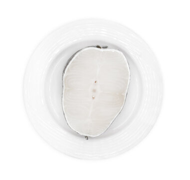 Raw sliced black cod fish on ceramic dish isolated on white background with clipping path.