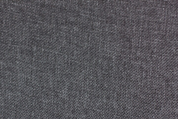 Macro of gray textured fabric.