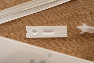 Top view of positive corona test © Joos1/Wirestock Creators