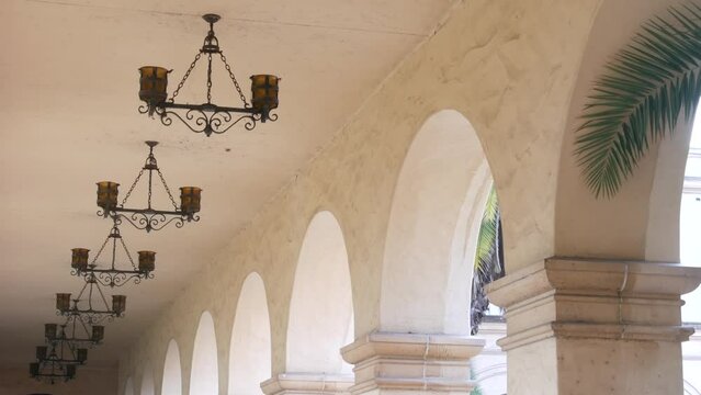 Spanish colonial revival architecture, Balboa Park, San Diego, California USA. Historic building, classic baroque or rococo romance style. Arches and columns of Casa, archway, vault, arcade or passage