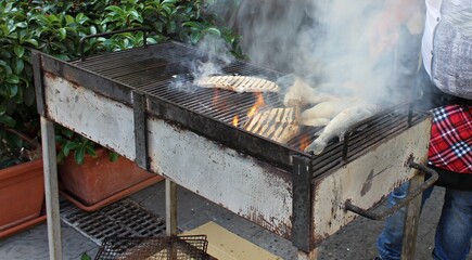 Italy, Sicily: Grilled fish in the street.