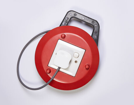 Extension wire with socket wrapped in a red drum