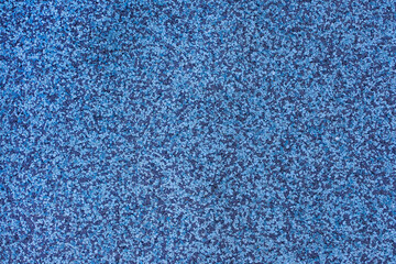 Fototapeta na wymiar Interior rubber flooring material in blue shade using in fitness ,gymnasium or playground for prevent accident. Close up of soft floor texture background.