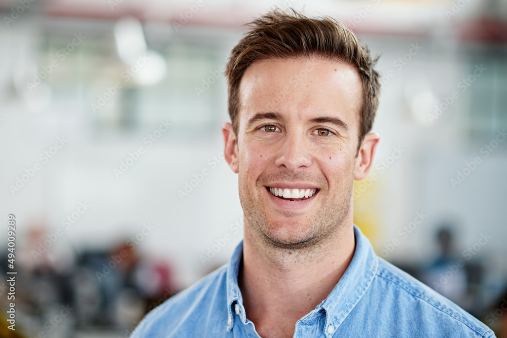 Poster i work for the love of it. portrait of smiling man in a casual work environment.