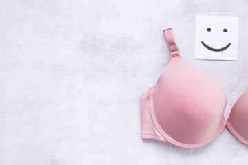 Breast cancer concept with pink bra. Women health background
