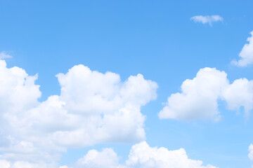Naklejka na ściany i meble Beautiful blue sky background with cloudy sunshine.