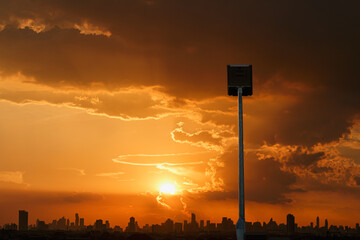 Solar cell street lamp pole on oranges  sky background of sunset in  city