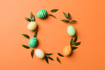 round frame Multi colors Easter eggs on colored background . Pastel color Easter eggs holiday concept with empty space for you design