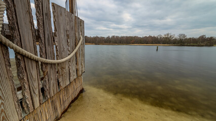 Wall with a rope leading into the silver lake, Germany, Lower Saxony, Hanover, Langenhagen