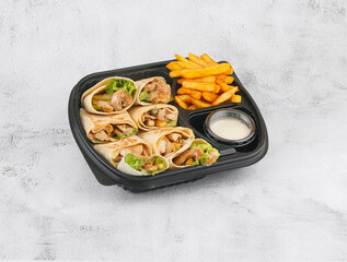 Arabic shawarma plate with appetizers and sauce