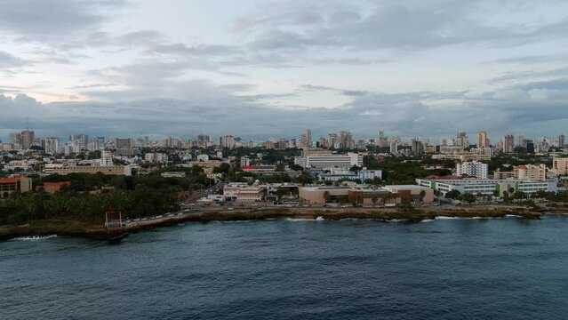 Malecon of Santo Domingo at sunset. Aerial sideways