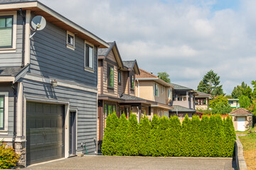 A perfect neighbourhood. Houses in suburb at Summer in the north America. Luxury houses with nice landscape.