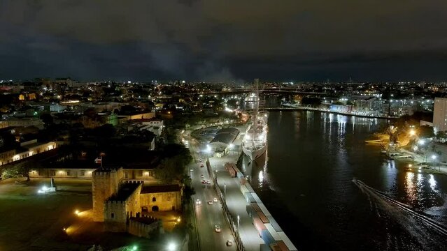 Timelapse of Colonial zone port at sunset with MSY Wind Surf cruise ship in background. Aerial static view. Day to night
