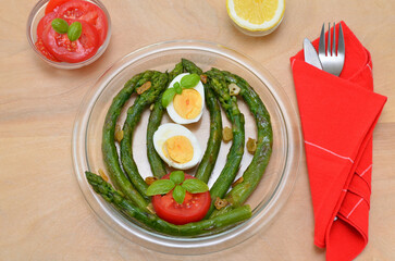 asparagus with tomatoes and eggs, table setting