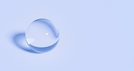 Clear glass ball shape on soft blue background