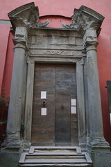Fototapeta na wymiar Entrance door to the Ariostesca fortress in Castelnuovo Garfagnana, Tuscany, Italy