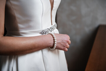 Wedding dress and pearl bracelet