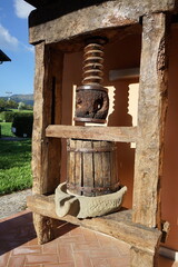 Old grape press in the fortress of Monte Alfonso in Castelnuovo Garfagnana, Tuscany, Italy