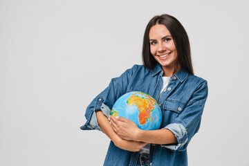 Geography concept. Caucasian young woman eco-activist hugging embracing Earth globe with care,...