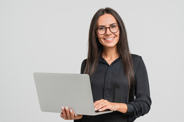 Smiling caucasian young businesswoman bank employee worker manager boss ceo looking at camera, using laptop for distant education work, e-learning, watching webinars online isolated in white