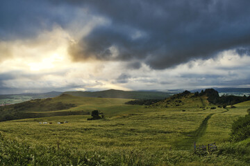 Obraz premium Grass on mountain hill during sundown. Beautiful summer landscape