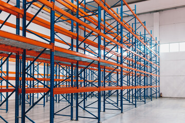Photo of an empty warehouse, colorful shelves.