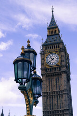Vertical shot of Big Ben and a street lamp in UK