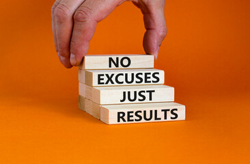 No excuses just results symbol. Concept words No excuses just results on wood blocks. Businessman hand. Beautiful orange table orange background. No excuses just results business concept. Copy space.