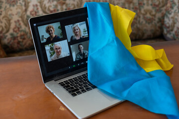 laptop with video near the flag of ukraine