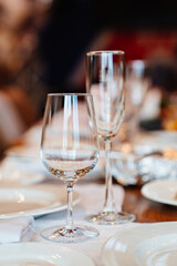 empty wine glasses on the table served for the holiday in the restaurant. tableware for home and cafe