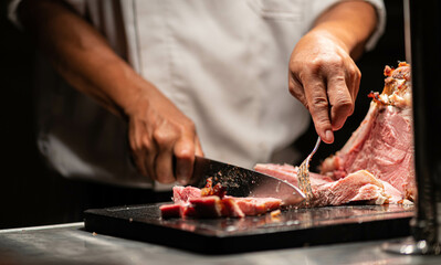 chef cutting meat