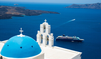 Top view from the church blue dome to a cruise ship and the seascape in Santorini, Greece