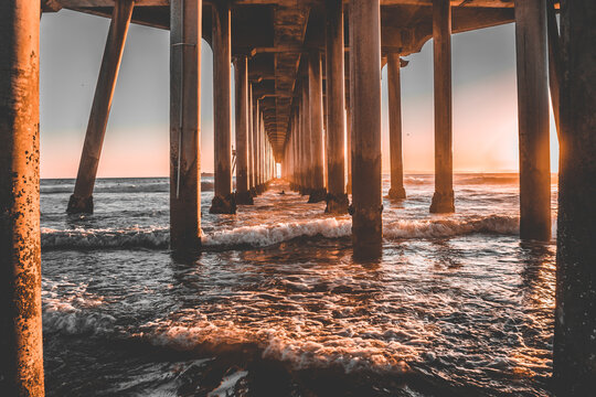 Under The Huntington Beach Pier, California At Sunset