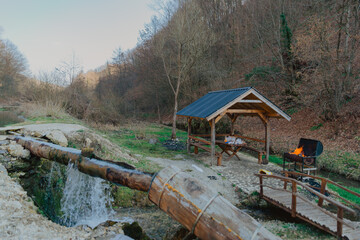 Shot of gazebo for barbecue in nature near the river