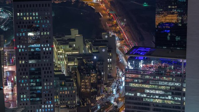 Office skyscrapers in financial district aerial night timelapse